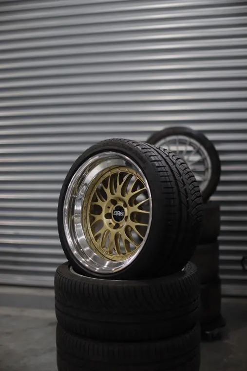 Stack of tyres with an alloy wheel